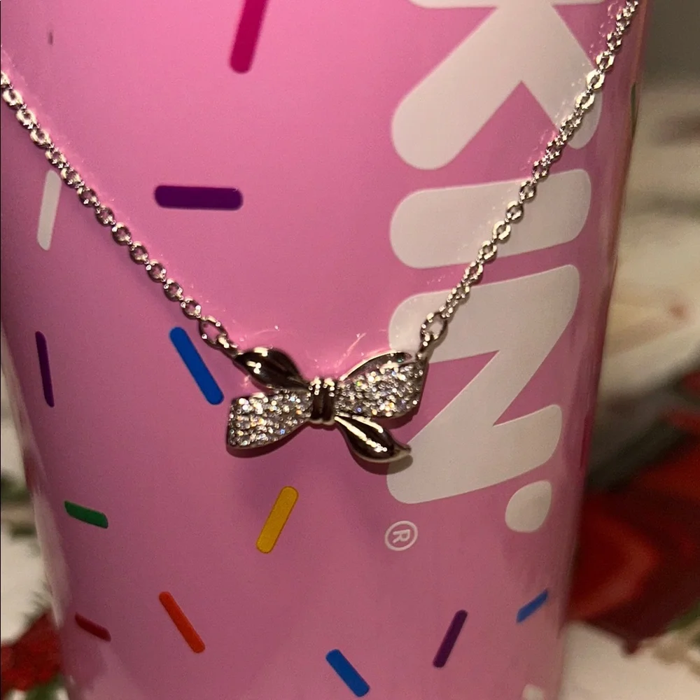 Chic Reversible Silver Bow Necklace with Cubic Zirconia Accent stones. - Picture 3 of 6